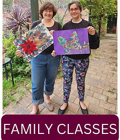 A mother and daughter holding up their Forage & Paint artwork after class