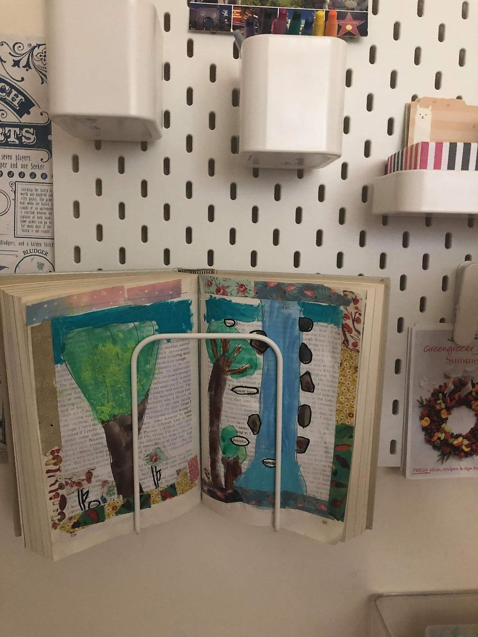 Altered book on a peg board