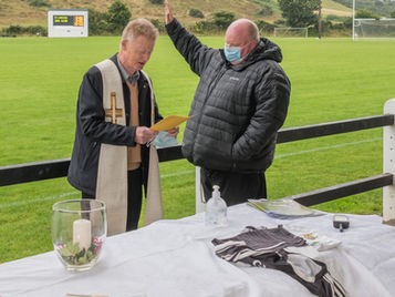 Fr. Jim Walsh and Fr. Charlie McDonnell Bless New Pitch.