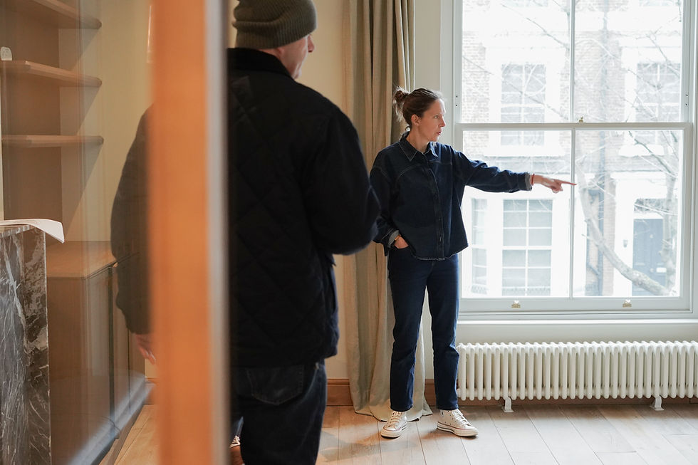 Interior designer Leo Wood discussing layout and design details during a London home renovation project