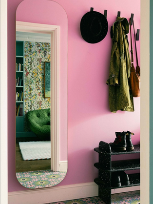 Kinder Design South East London Project in Waterloo Bright Pink Hallway with Mirror and coats hanging up and boots below