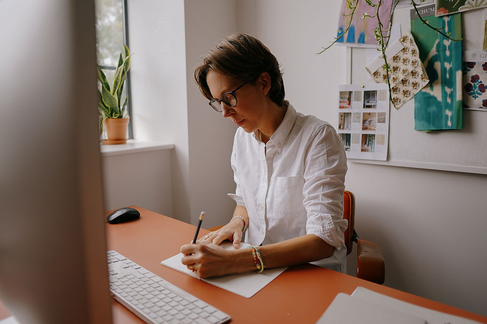 Founder and interior designer Leo Wood working in her studio