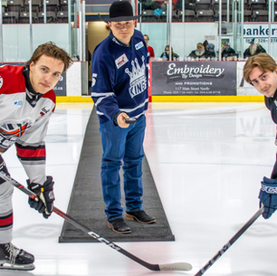 Brayden Byrne drops the puck at the center ice
