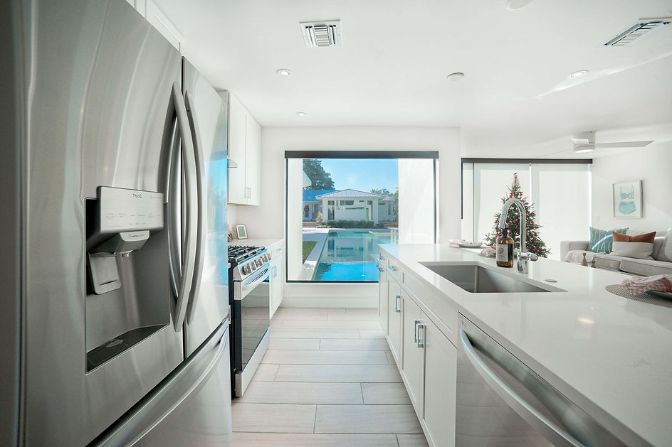 Custom home kitchen with pool view in Sarasota Florida
