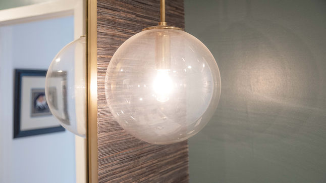 Close-up of bathroom pendant light in modern Siesta Key home renovation