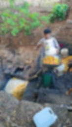 mashing cashew fruit