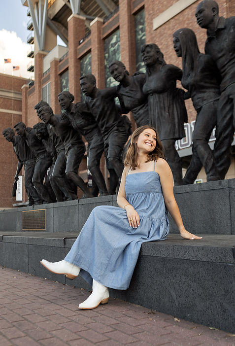 Texas A&M graduate sitting infront of Kyle field