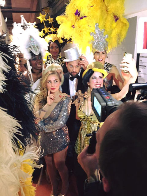 Chixx Clique artists during a performance in glittery twenties outfits posing for the cameras