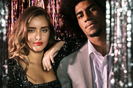 Cute couple posing in a curtain of sparkles – What Is Soft Swap