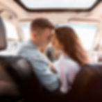 couple in a car kissing