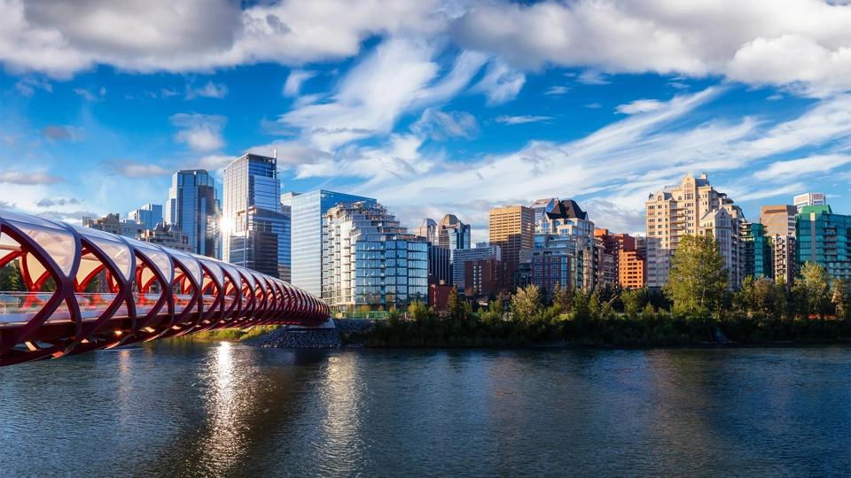 Wide landscape view of the Calgary skyline at twilight with cool tones