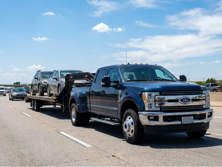 Car hauler transporting two vehicles