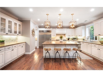 Spanish Mediterranean Rival style home interior, kitchen, island, pendants