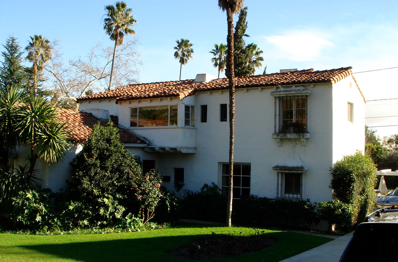 Spanish Mediterranean Revival style home, exterior day view, white stucco