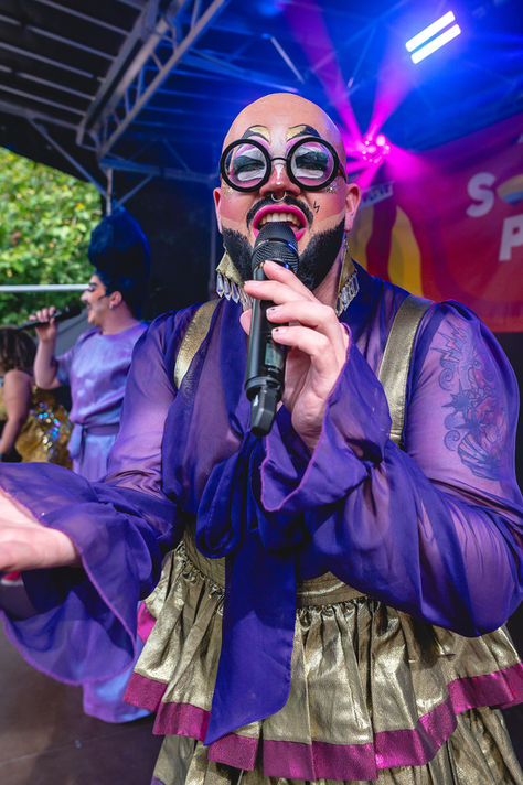 Documentary event photography showing live performer and audience atmosphere