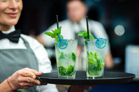 Event detail photography showing branded drinks during corporate reception