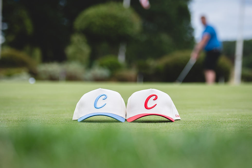 Clivet branded golf caps photographed on the green at The Belfry