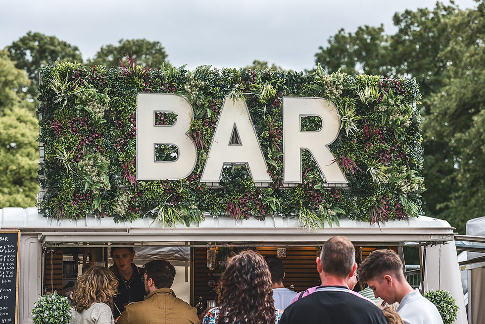 Vanderbar mobile bar serving visitors during an outdoor festival at Himley Hall