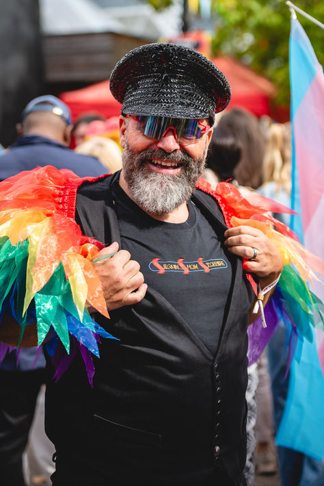 Documentary public event photography showing colourful participant portrait