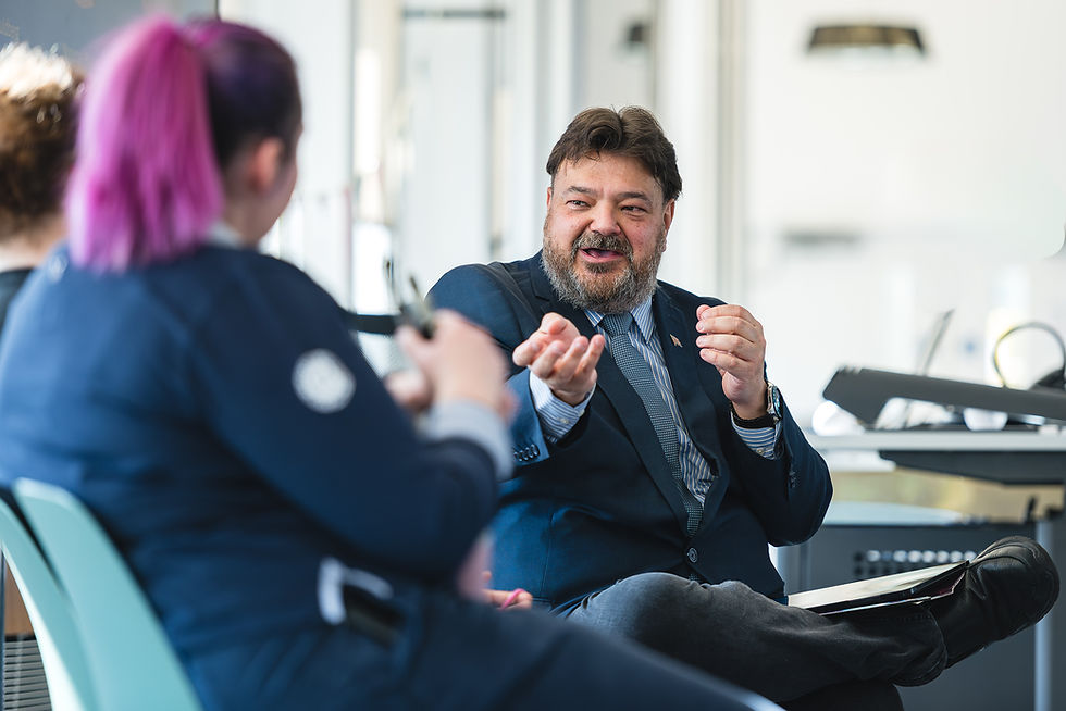 Speaker taking part in a discussion during a University of Birmingham neurodiversity training event.