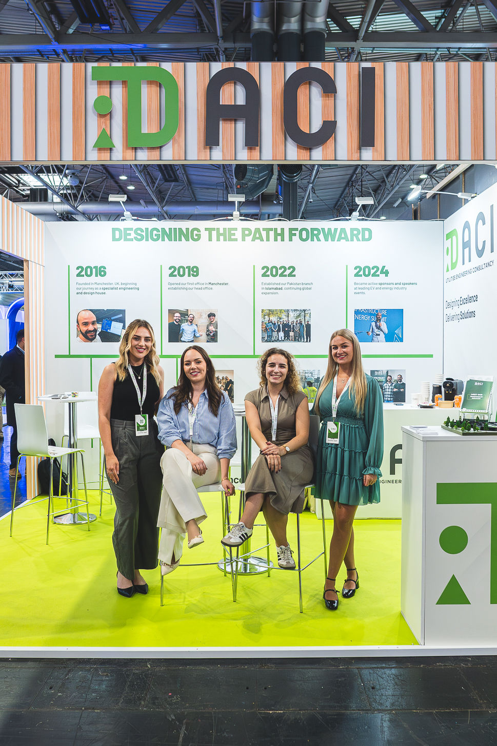 DACI team photographed on their exhibition stand at Solar and Storage Live at the NEC Birmingham.