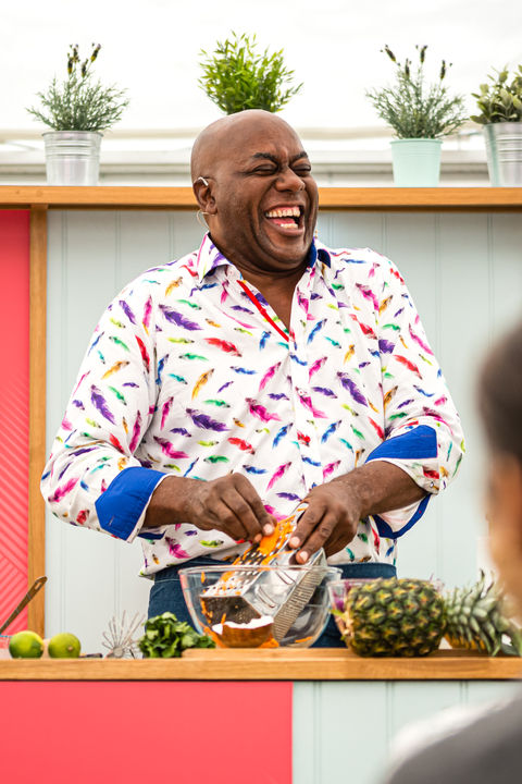 Celebrity tv chef Ainsley Harriott laughing as he cooks at a food festival in Solihull. Photographed in action by Birmingham based PR photographer Aaron Scott Richards