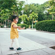 Toddler Girl Chasing Bubbles
