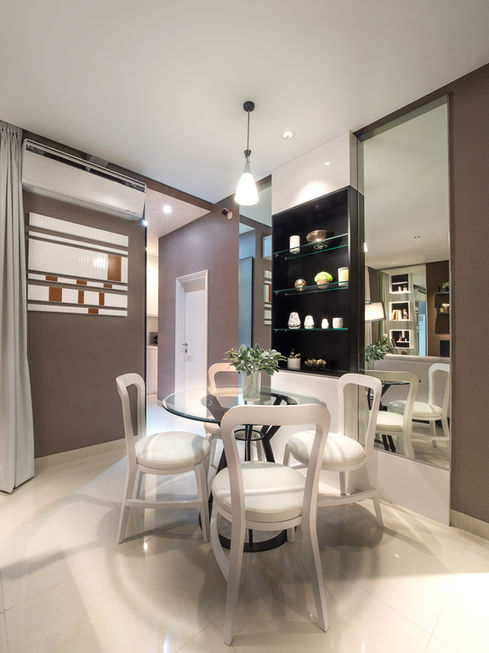 Architectural view of a residential dining space highlighting custom built-in shelving and large wall mirrors.