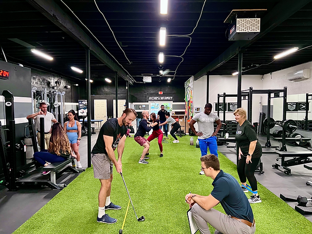 People doing physical therapy and sports rehab in a gym