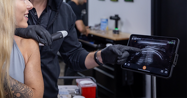 Showing patient a real-time ultrasound of shoulder