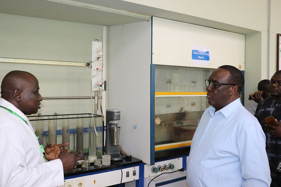 Picture 2: Dr. Simeon Ehui (on the left) visiting AfricaRice Soil Laboratory. (Credit: A. A. Diomandé)