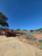 Eye-level view of a newly constructed animal pad with natural materials, kubota skid steer