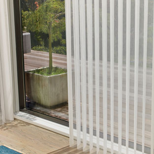 Luminettes are an elegant vertical solution for a large window wall