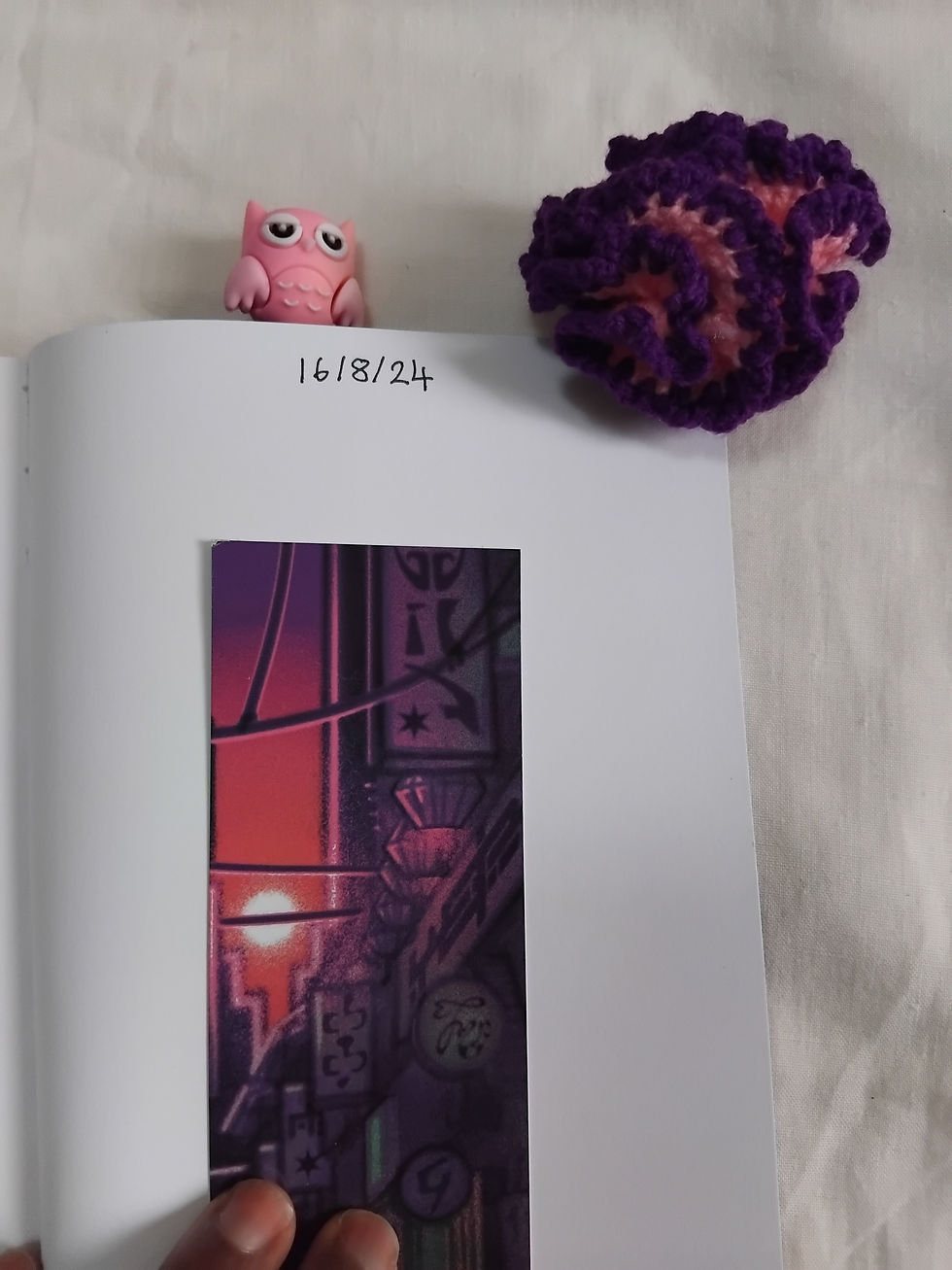 Other Worlds Anthology by A Coup of Owls Pres. Image shows a bookmark made with the cover image. Busayo Akinmoju's The Shifters Of The Hills Story.