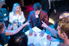 a card appears in danny's mouth while guests watch in awe