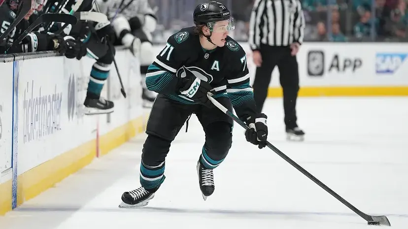 Close-up view of a hockey player performing a look-off on the ice