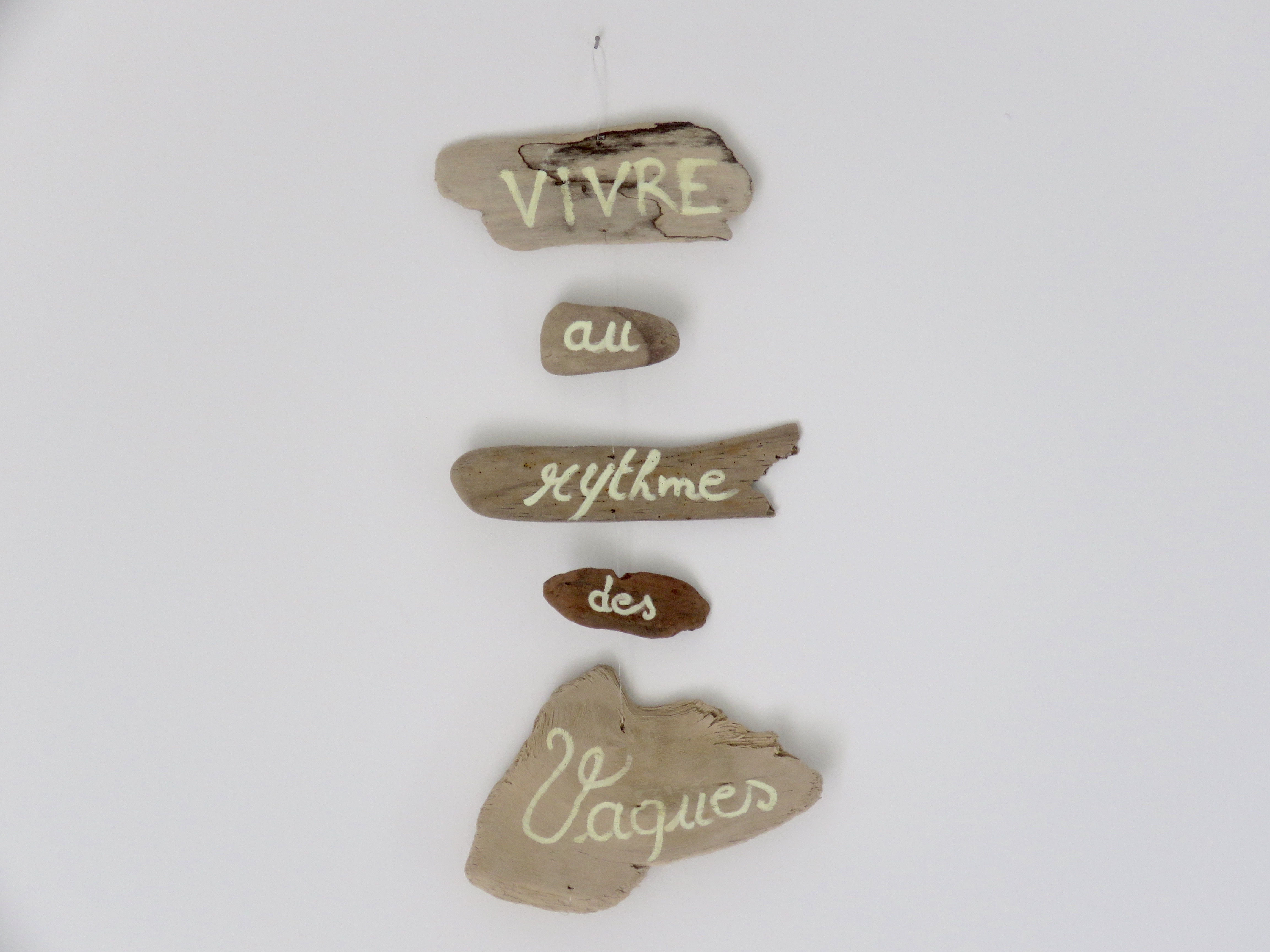 Ecriteau "Vivre au rythme des vagues"