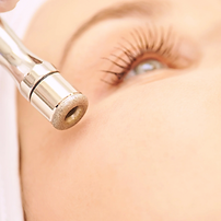 A lady receiving a microdermabrasion treatment
