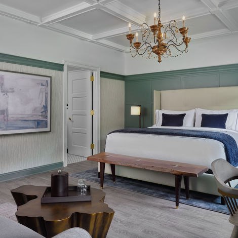 An interior photo of a bedroom at the NorthPort Hotel.