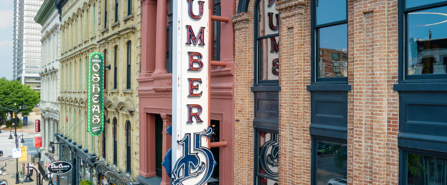 A photo of the exterior of Number 15 Louisville showing a close up of the building sign which says "number 15".