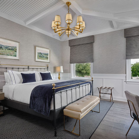 An interior photo of a bedroom at the NorthPort Hotel.