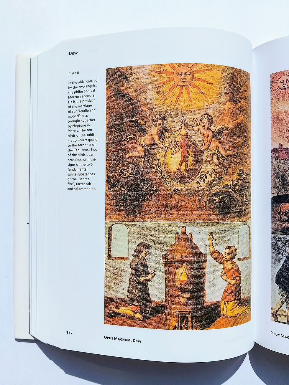 Alchemy illustration with two angels holding a vial under a sun, and two figures kneeling by a furnace. Text: "Opus Magnum: Dew."