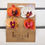 Thumbnail: mixed orange mini orchid "U" pin hair clips. set of 4 on a brown card backing. white wood background