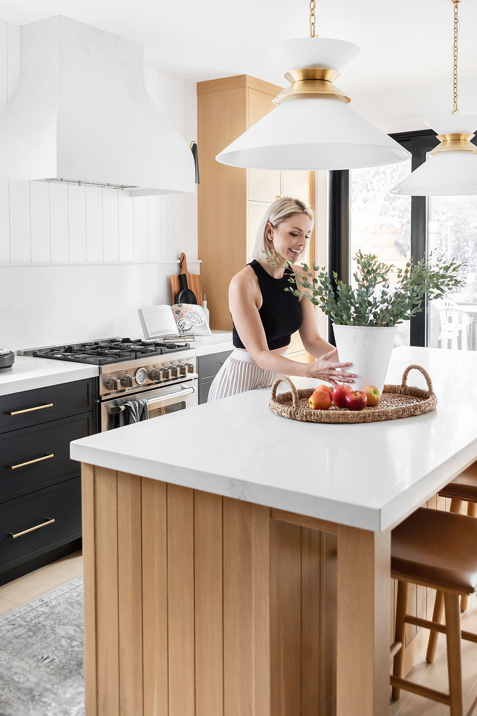 Fall Inspiration, Woman at counter, basket tray, modern kitchen, elevate, interior design tips,