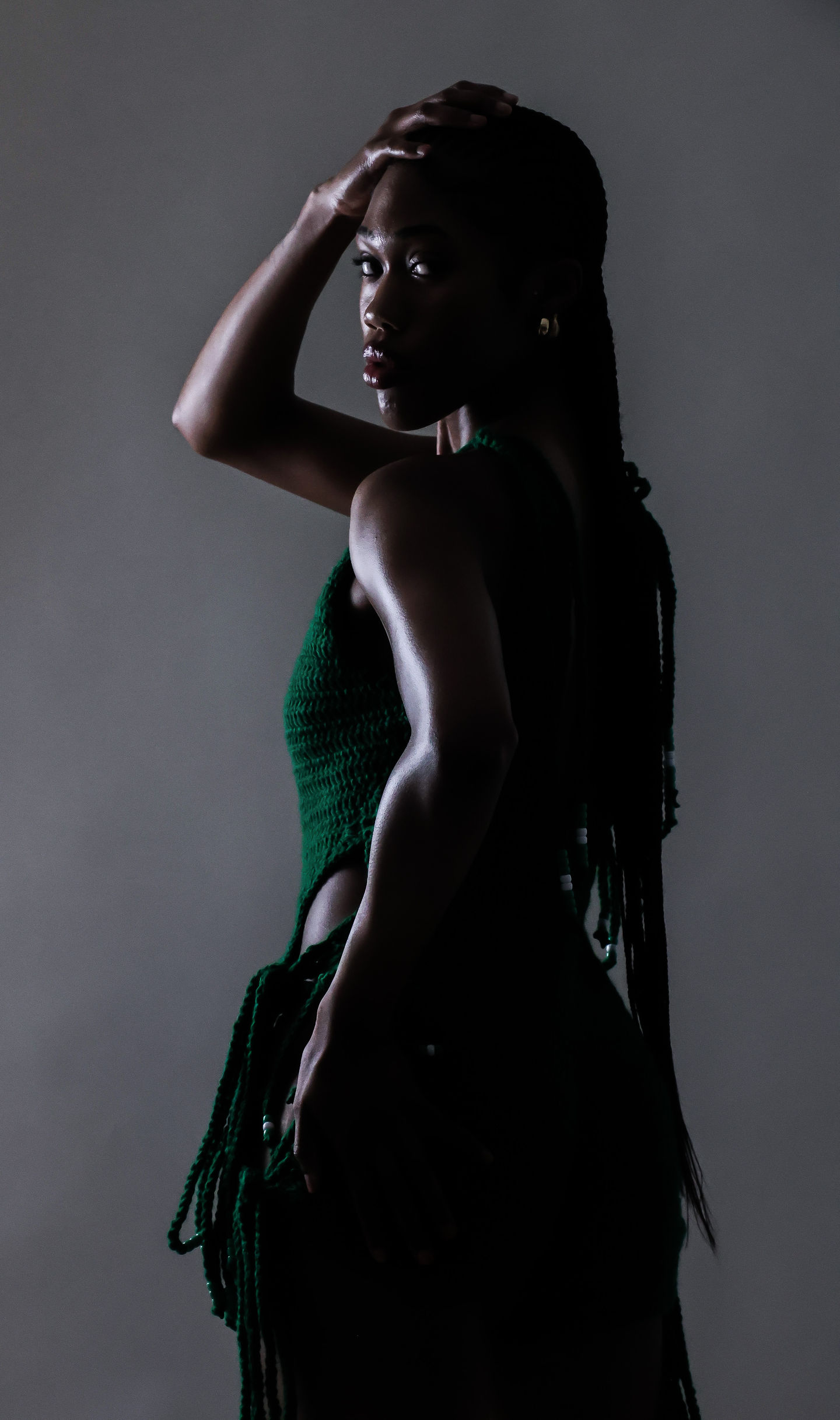 Backlit silhouette of woman in moody shadows – emotional stillness