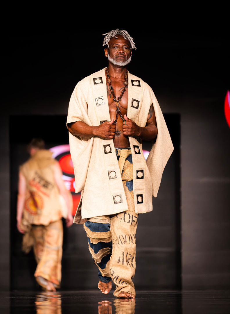 Male model in ceremonial robe with Aztec print – stylized designer appearance