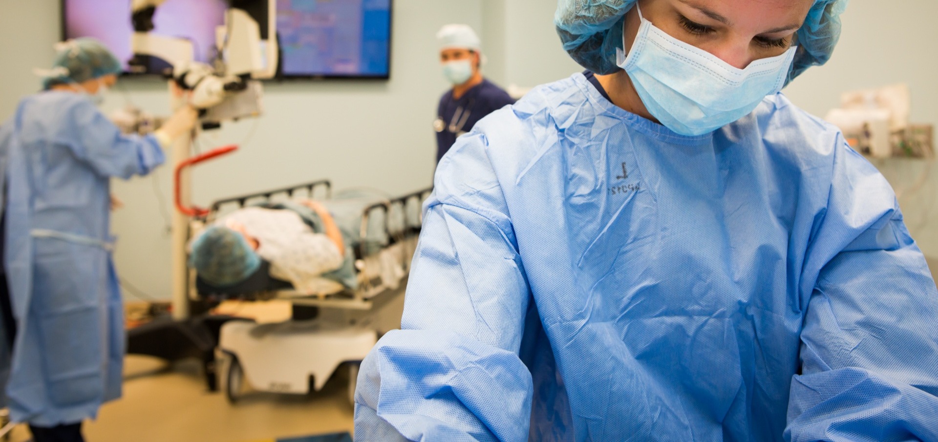 Staff operating laser equipment in clinical setting