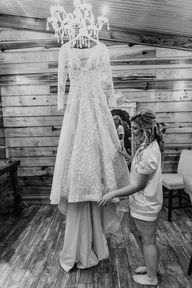 bride looking at wedding gown