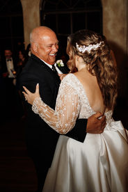 Bride and dad dancing together