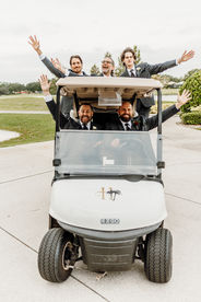 groom and groomsmen on golf cart